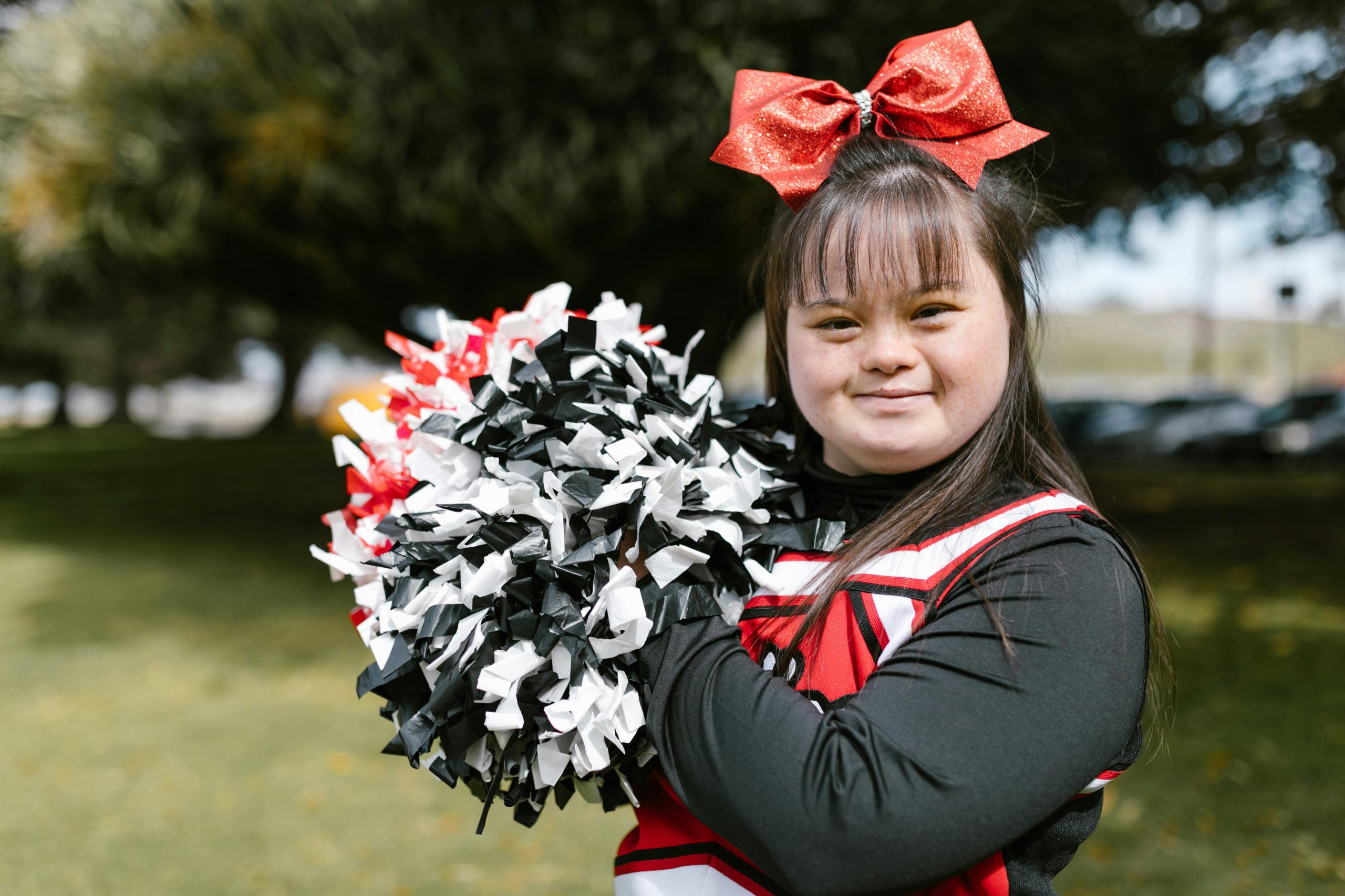 girl with down syndrome dressed in a cheerleader uniform