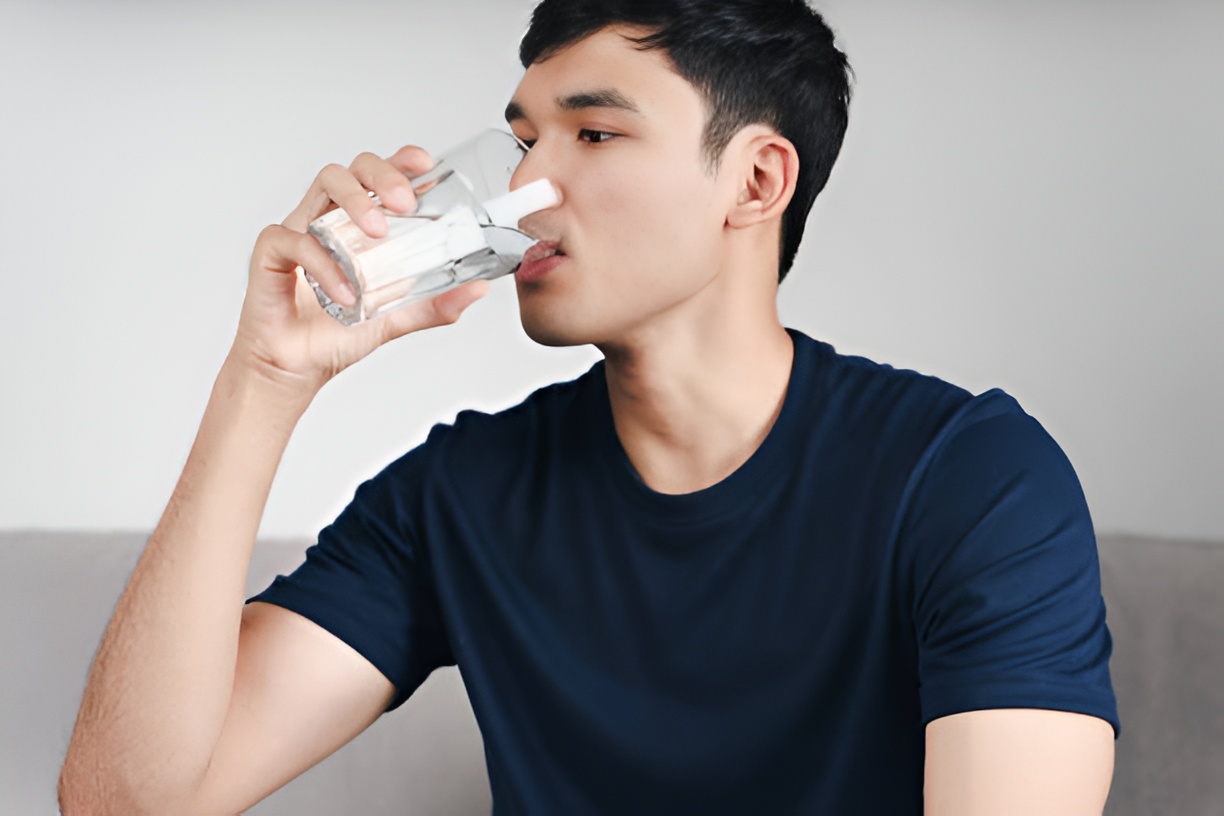 man drinking water